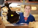Hockey star Caroline Harvey works a celebratory 'shift' at Raising Cane's Times Square on March 9 in New York.