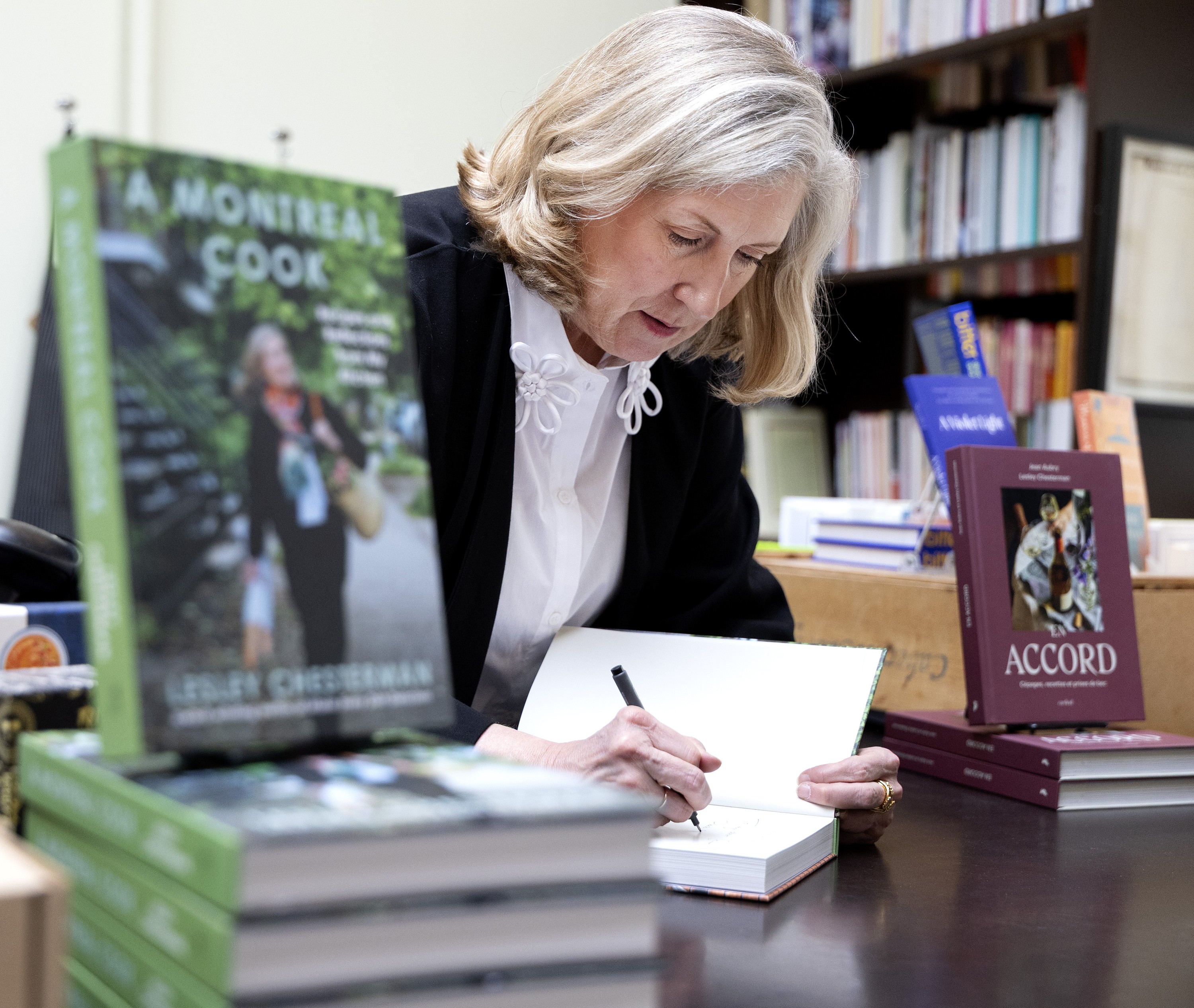 Food writer Lesley Chesterman signs copies of her book A Montreal Cook at a bookstore.