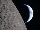 This handout picture released on April 7, 2026, by NASA shows crescent Earth setting along the moon's limb, as seen from the Orion spacecraft on April 6, 2026. The edge of the visible surface of the Moon is called the