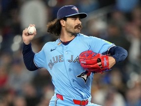 Blue Jays right-hander Dylan Cease throws a pitch