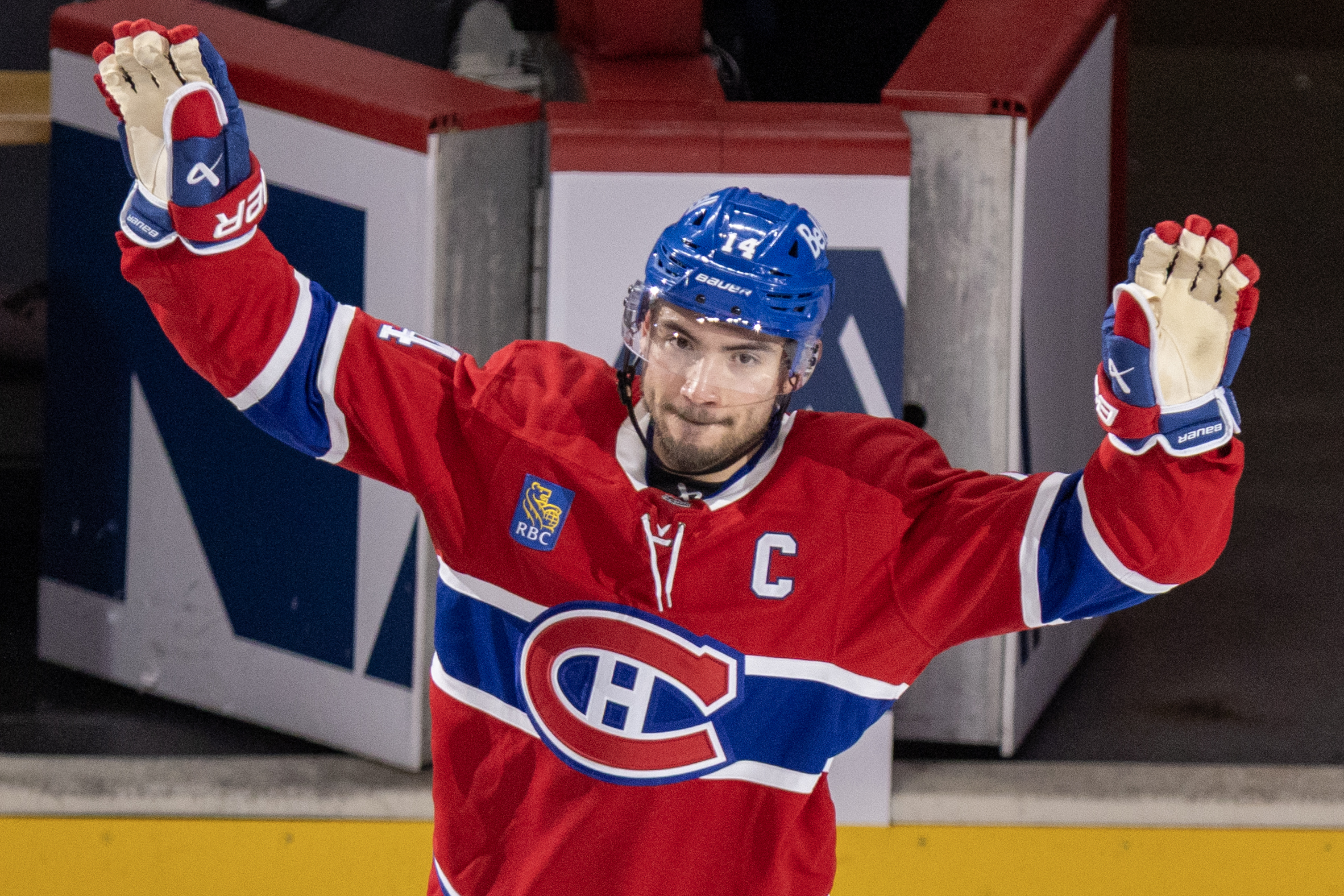 Hockey player acknowledges cheers after being named third star of a game.