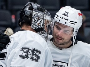 Los Angeles Kings goaltender Darcy Kuemper (35) celebrates with Scott Laughton (21) after defeating the Vancouver Canucks last month.