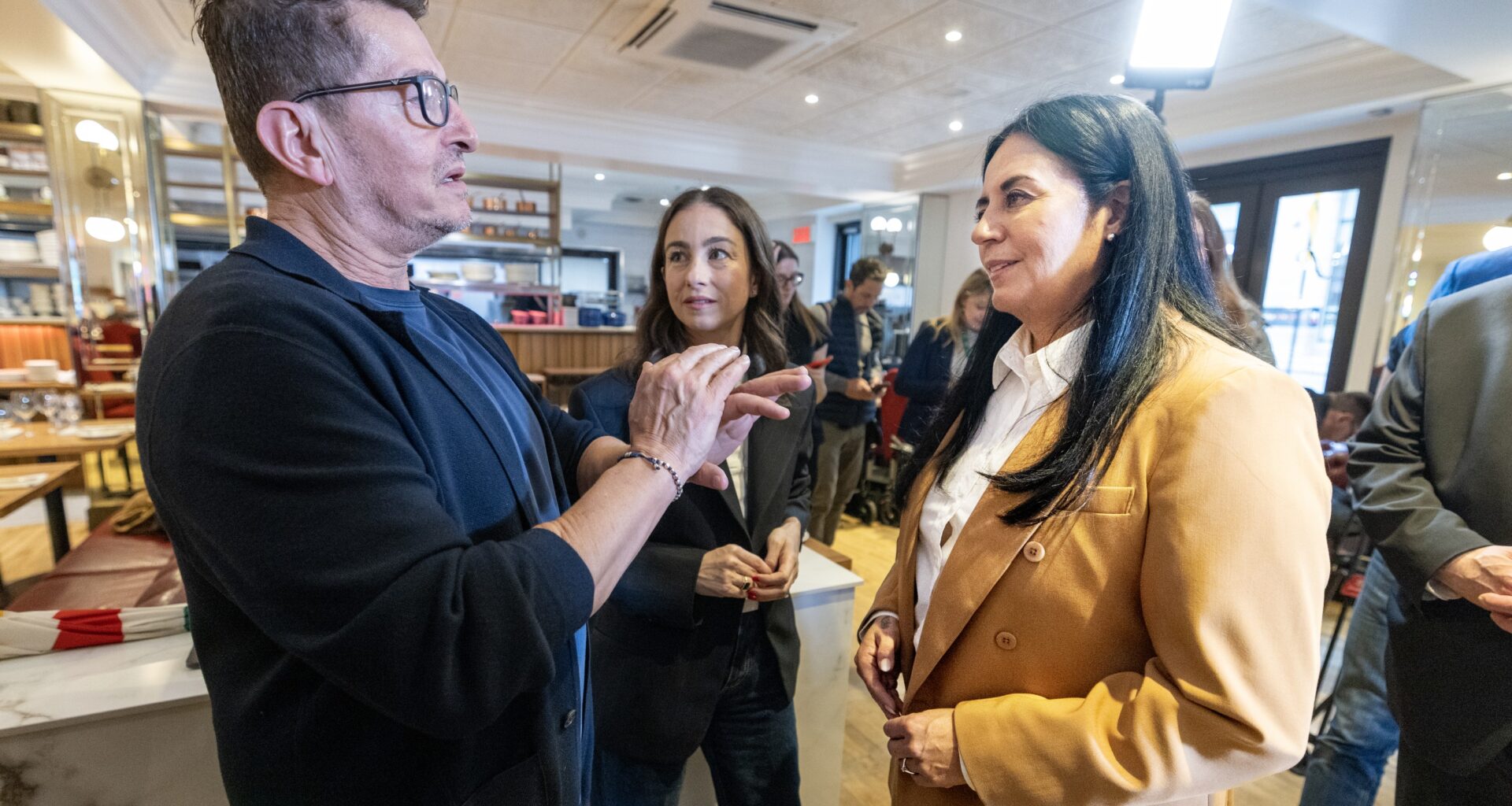 Restaurant owner, right, speaks to Montreal