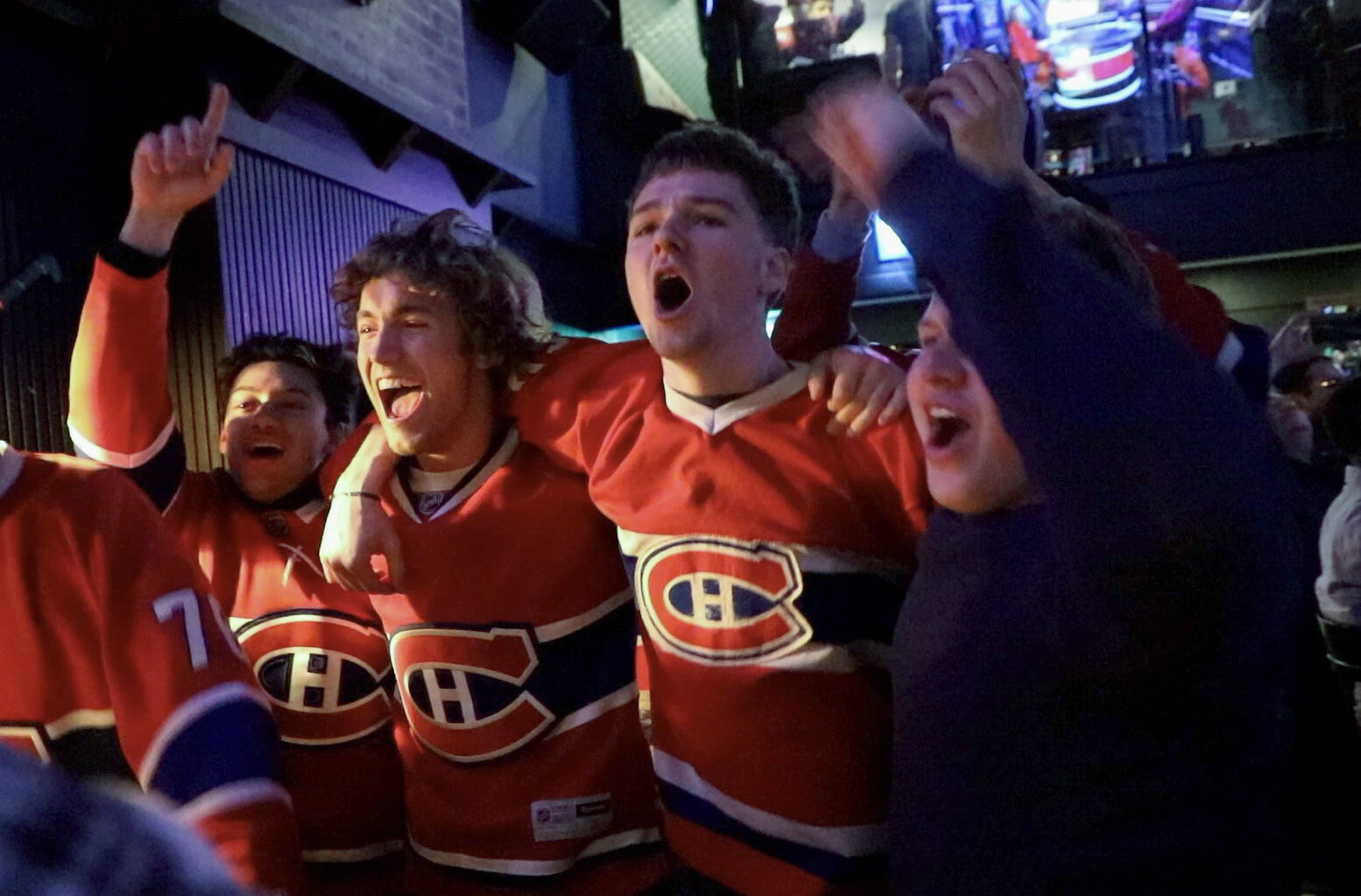 Fans celebrate in Montreal on Sunday night after the Canadiens won in overtime against the Tampa Bay Lightning in Game 1 of their playoff series.