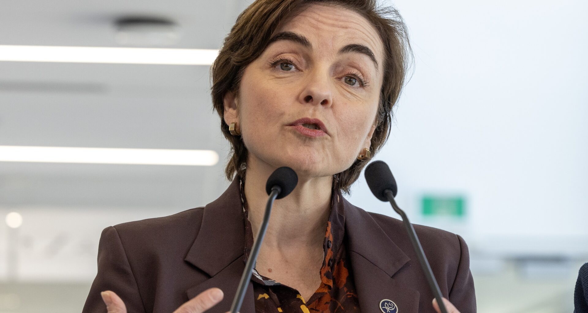 Christine Fréchette speaks at a podium.