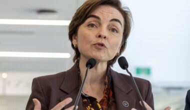 Christine Fréchette speaks at a podium.