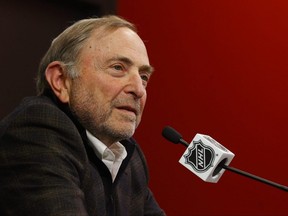 NHL commissioner Gary Bettman speaks to media members
