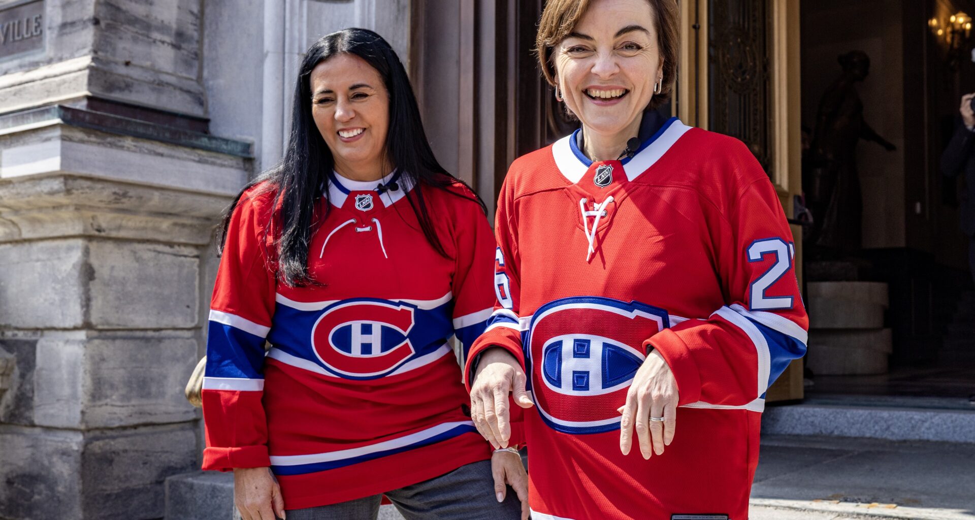 Montreal Mayor Soraya Martinez Ferrada and Québec Premier Christine Fréchette in Montreal Canadiens jerseys outside city hall in Montreal.