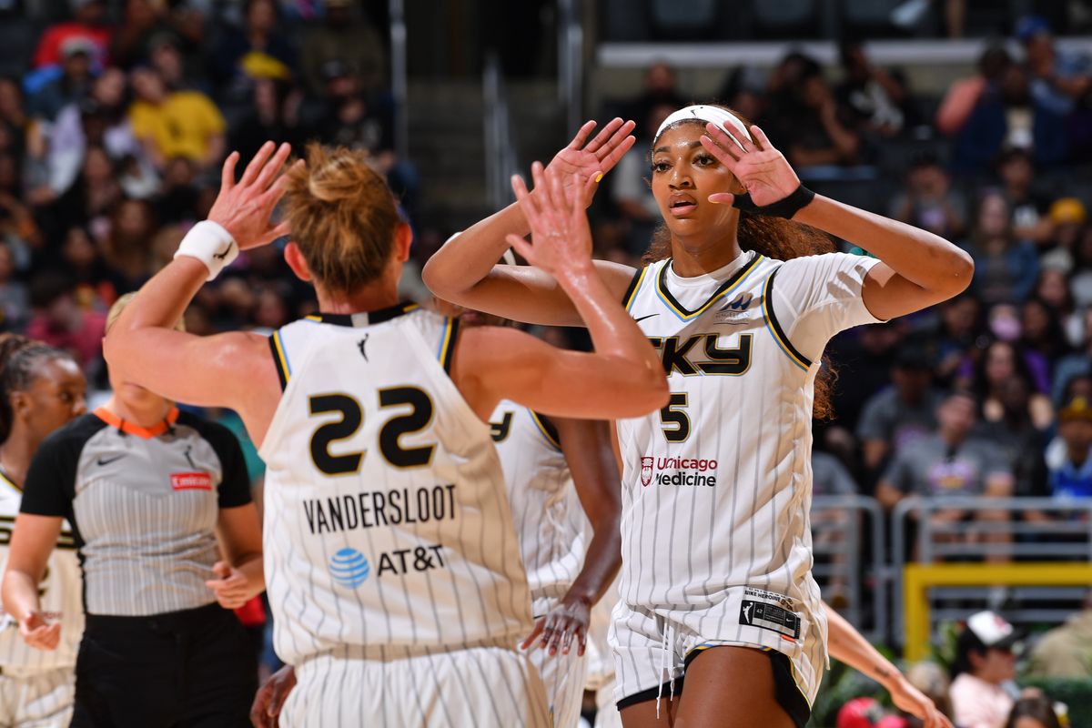 Angel Reese #5 of the Chicago Sky high fives Courtney Vandersloot #22 during the game against the Los Angeles Sparks