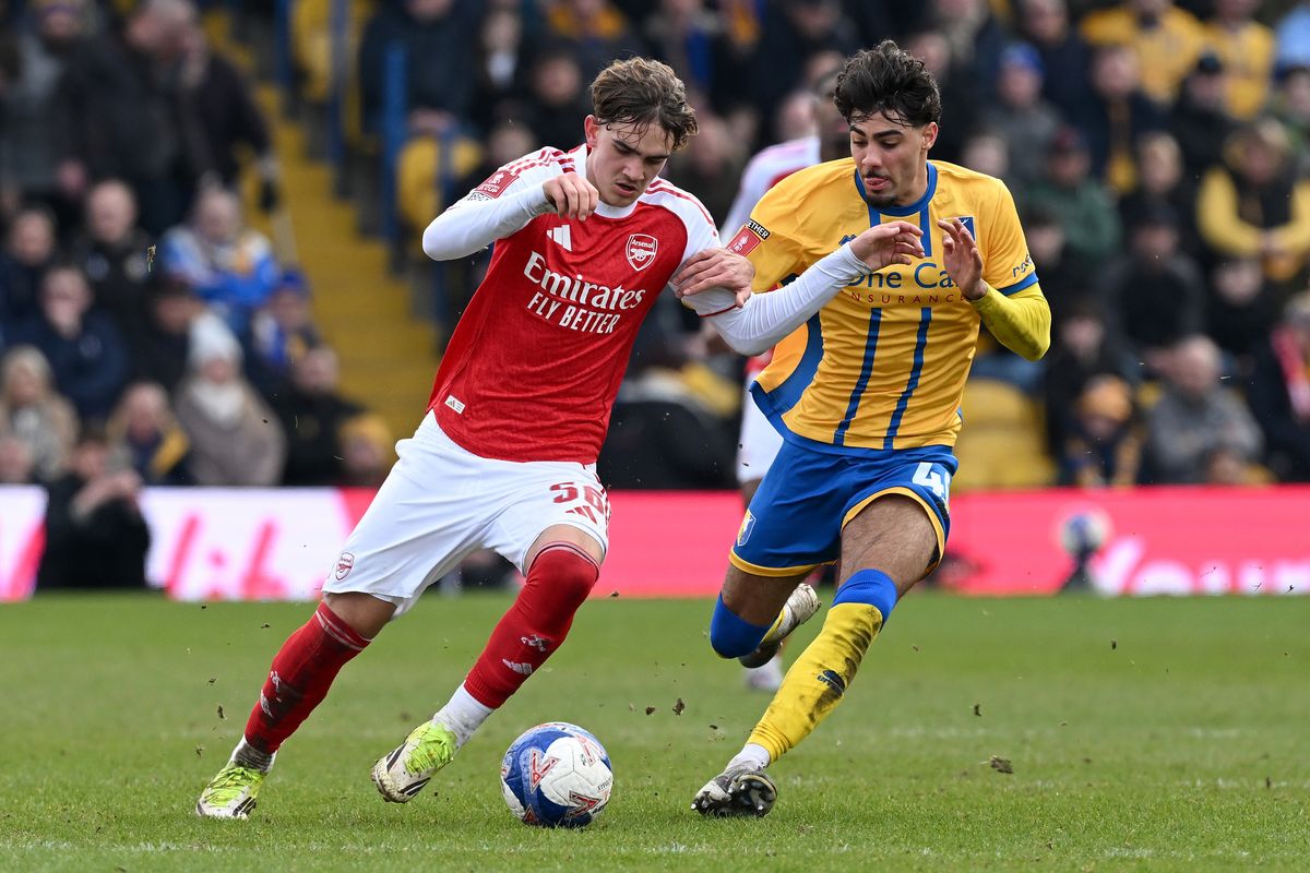 George Abbott, right, up against Arsenal's Max Dowman in the FA Cup this year, has suffered a quad injury
