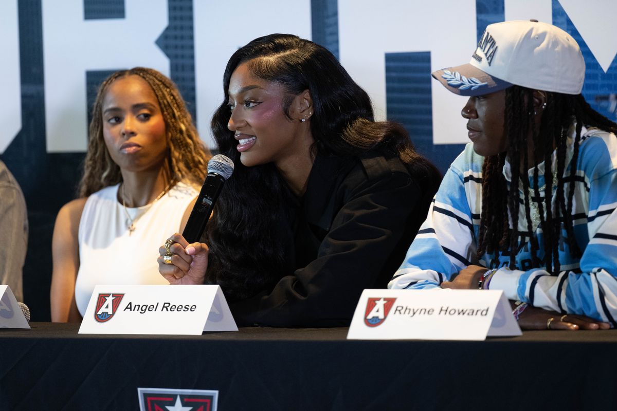 Angel Reese speaks at a Dream press conference