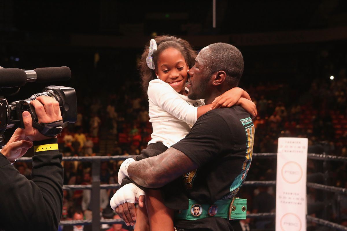 Deontay Wilder with his daughter