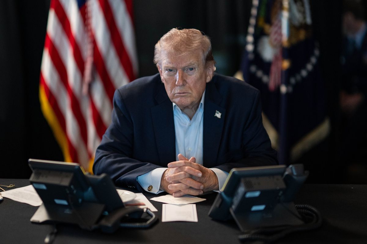 U.S. President Donald J. Trump sits at a table monitoring military operations during Operation Epic Fury against Iran, with U.S. flags visible behind him, in Washington, United States, on March 02, 2026.