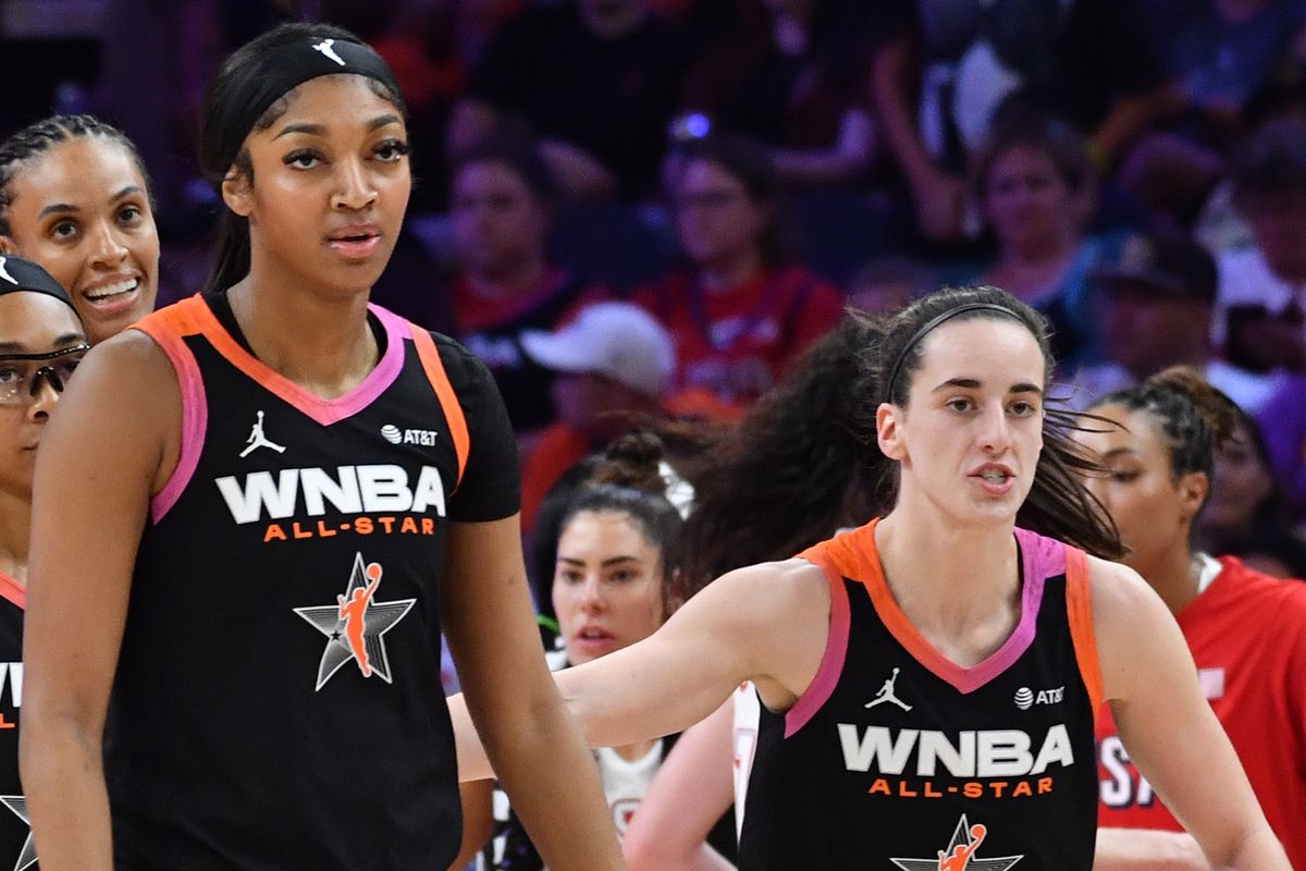 Angel Reese #5, and Caitlin Clark #22 of Team WNBA walk during the 2024 WNBA All Star Game on July 20, 2024 at Footprint Center in Phoenix, Arizona