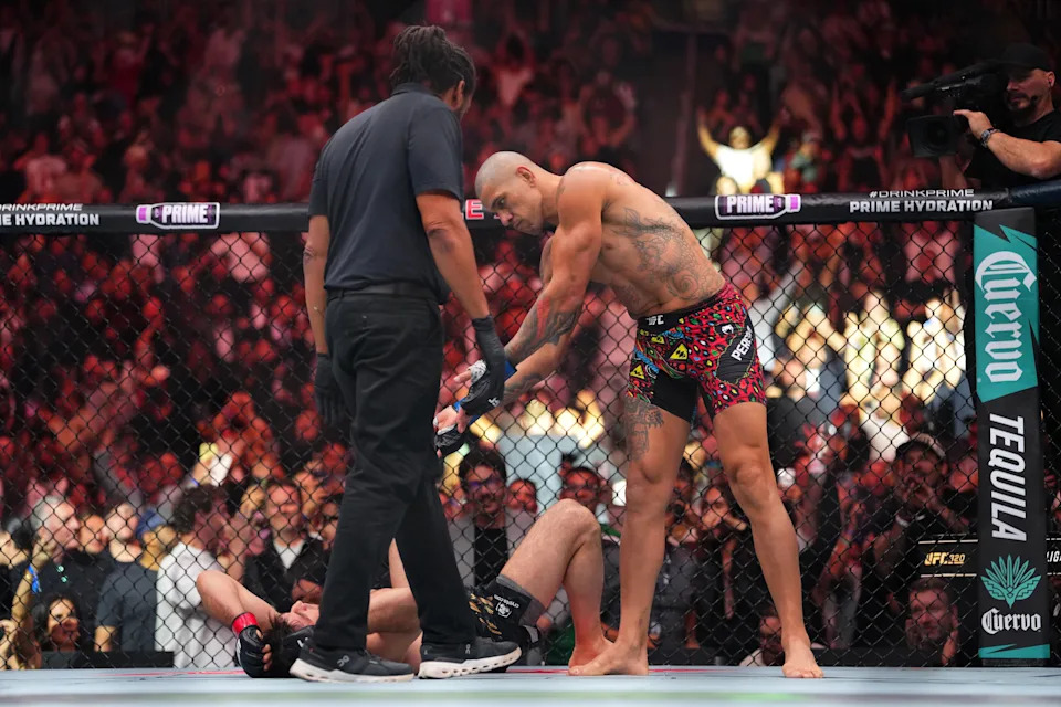 LAS VEGAS, NEVADA - OCTOBER 04:  (R-L) Alex Pereira of Brazil celebrates his TKO victory over Magomed Ankalaev of Russia in their light heavyweight title fight at T-Mobile Arena on October 04, 2025 in Las Vegas, Nevada. (Photo by Cooper Neill/Zuffa LLC)
