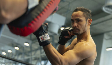 Muay Thai legend Sam A Gaiyanghadao punches the pads at Evolve MMA