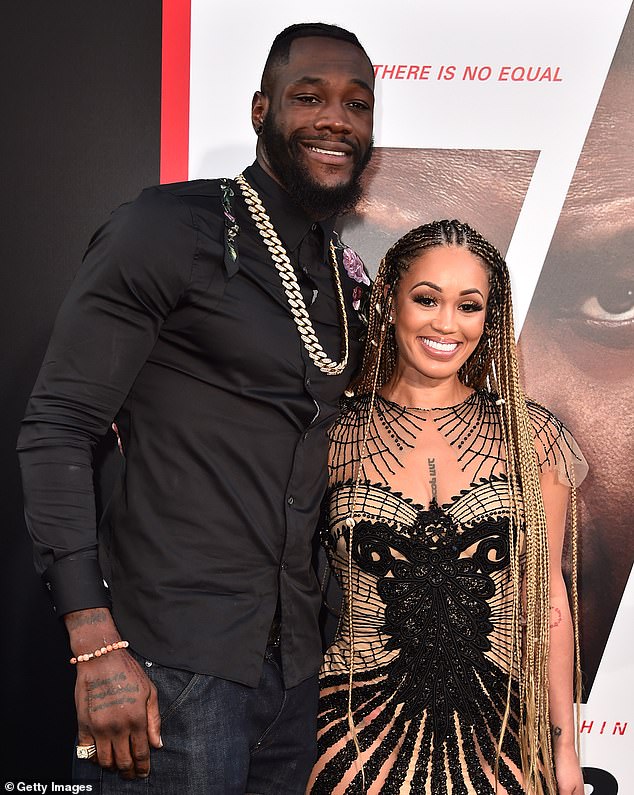 Deontay Wilder is accused of beating the son of his ex-fiancee, Telli Swift (right, in 2018)