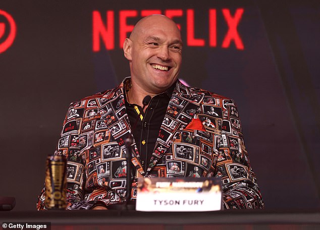 Fury looks leaner after losing a stone or two and tanned after his time working abroad