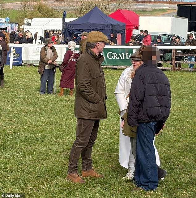 Geri (in all white) in conversation with her husband Christian Horner at the point-to-point