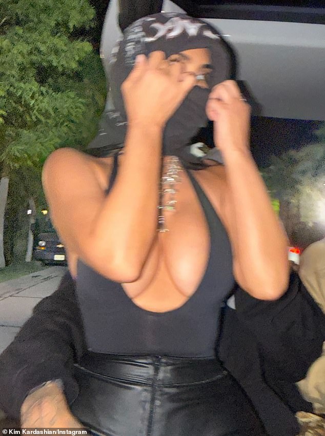 In one image, Kardashian could be seen sitting on Hamilton's lap as they rode in a golf cart through the crowded grounds