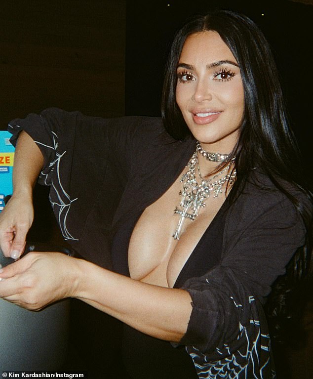 Kardashian continued to flaunt her Lewis Hamilton romance as she posted a busty snap while sitting on the F1 racer's lap as they attended weekend one of Coachella last week