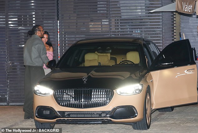 Hamilton was seen approaching the passenger side door to open it for Kardashian