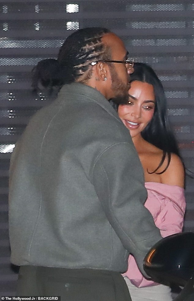 Kardashian had a massive smile on her face as she cuddled up to the sports star