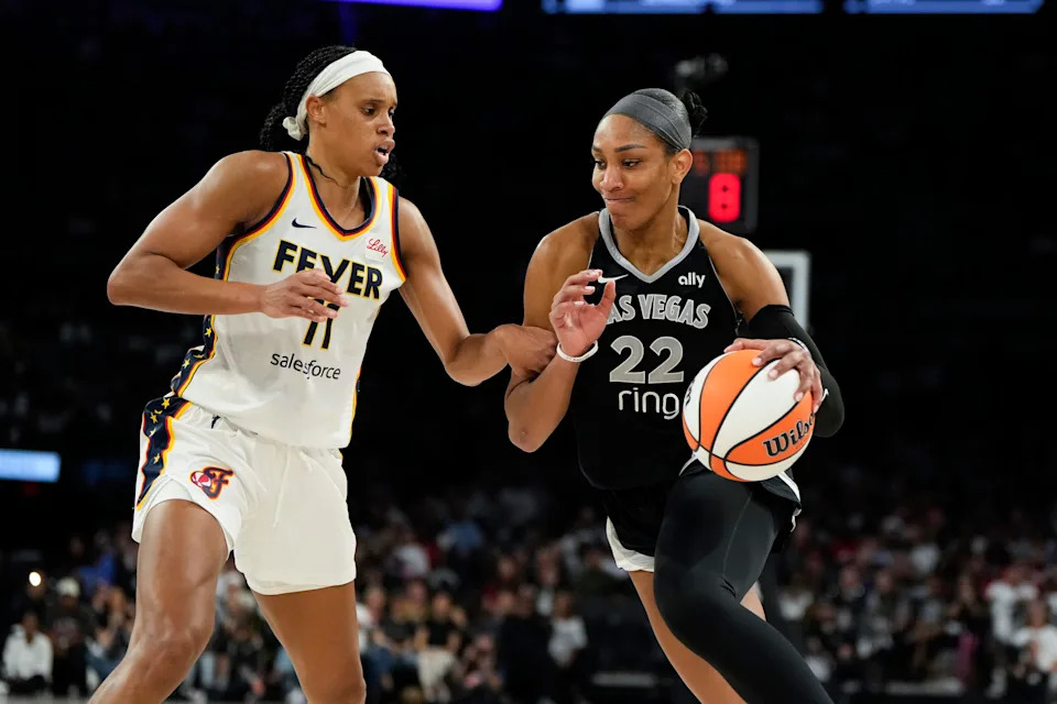 Indiana Fever forward Brianna Turner, left, defends against Las Vegas Aces center A'ja Wilson on Sept. 23, 2025, in Nevada.