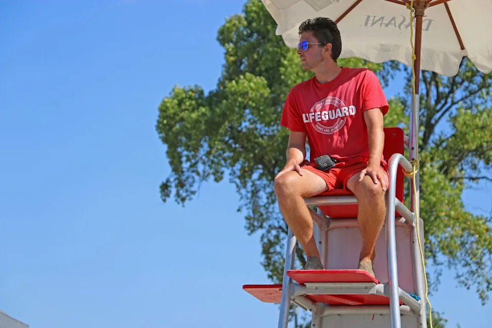 A lifeguard looks over Kitsilano Beach in Vancouver.