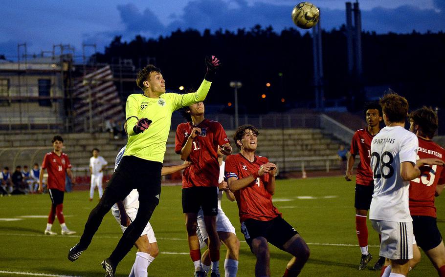 Peter Sudimak punches away the ball from the goal.
