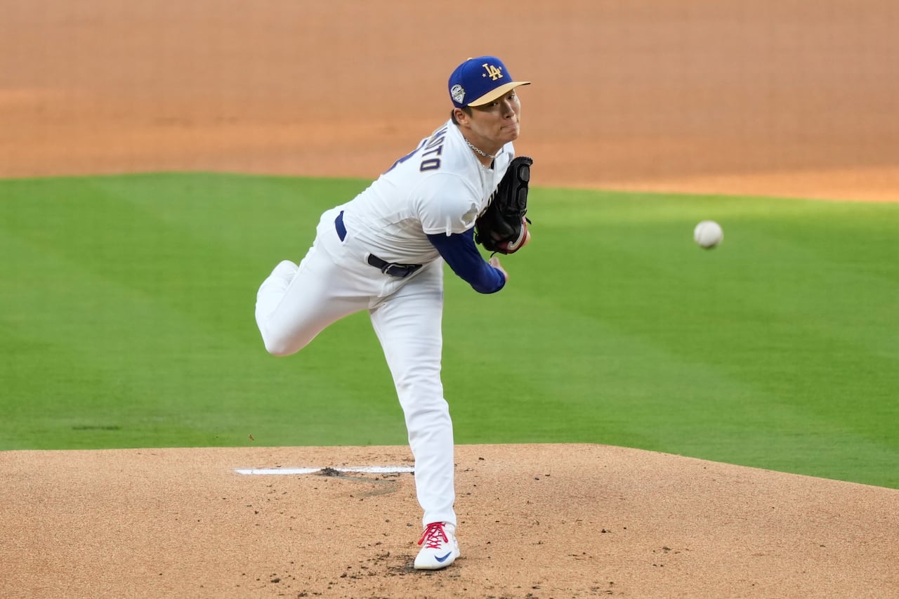 L.A. Dodgers pitcher Yoshinobu Yamamoto fires a pitch from the mound