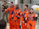 (L-R) Mission specialist Jeremy Hansen of CSA (Canadian Space Agency), pilot Victor Glover, commander Reid Wiseman and mission specialist Christina Koch walk out of the Neil A. Armstrong Operations and Checkout Building ahead of the launch of the Artemis II at NASA's Kennedy Space Center on April 01, 2026 in Cape Canaveral, Florida. The 322-foot-tall Artemis II Space Launch System rocket and Orion spacecraft will take the astronauts around the moon and back, 230,000 miles out into space and the farthest any human has ever traveled from Earth.