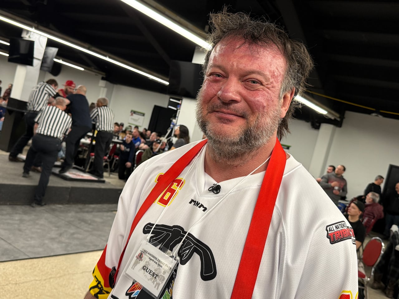 A man wearing a hockey jersey.
