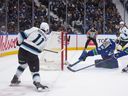 Utah Mammoth's Dylan Guenther scores against Vancouver Canucks goalie Nikita Tolopilo on Saturday, April 4, 2026.