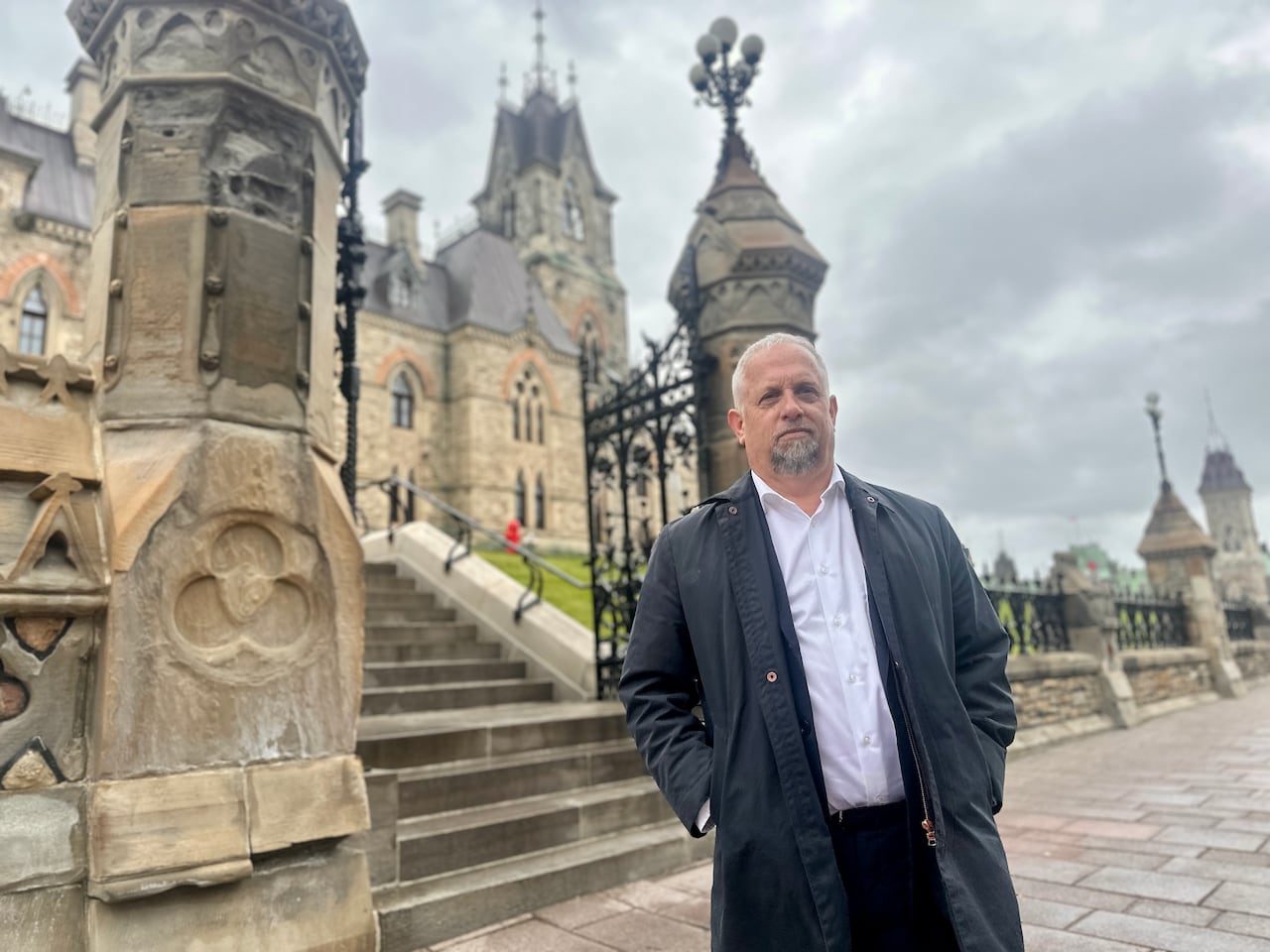 man in suit on parliament hill