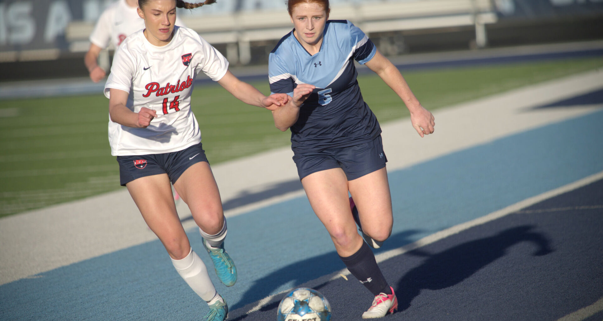 Greenwood's Emily Jones (right) dribbles the soccer ball while being defended by Lubbock-Cooper Liberty's Emily Southwell, Feb. 24, 2026, at J.M. King Memorial Stadium. 