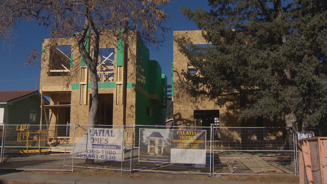 Two side-by-side homes under construction 