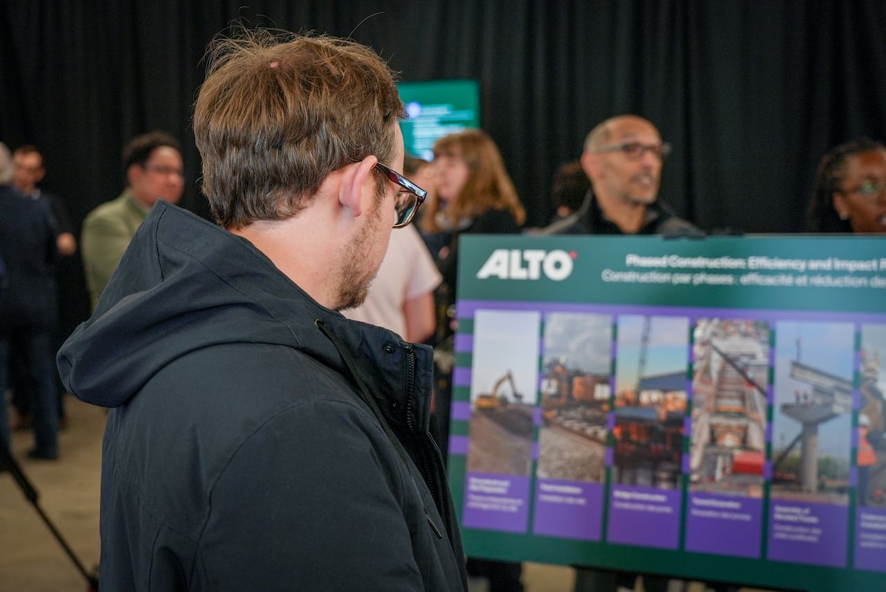 Man looks at diagram of high-speed rail network.