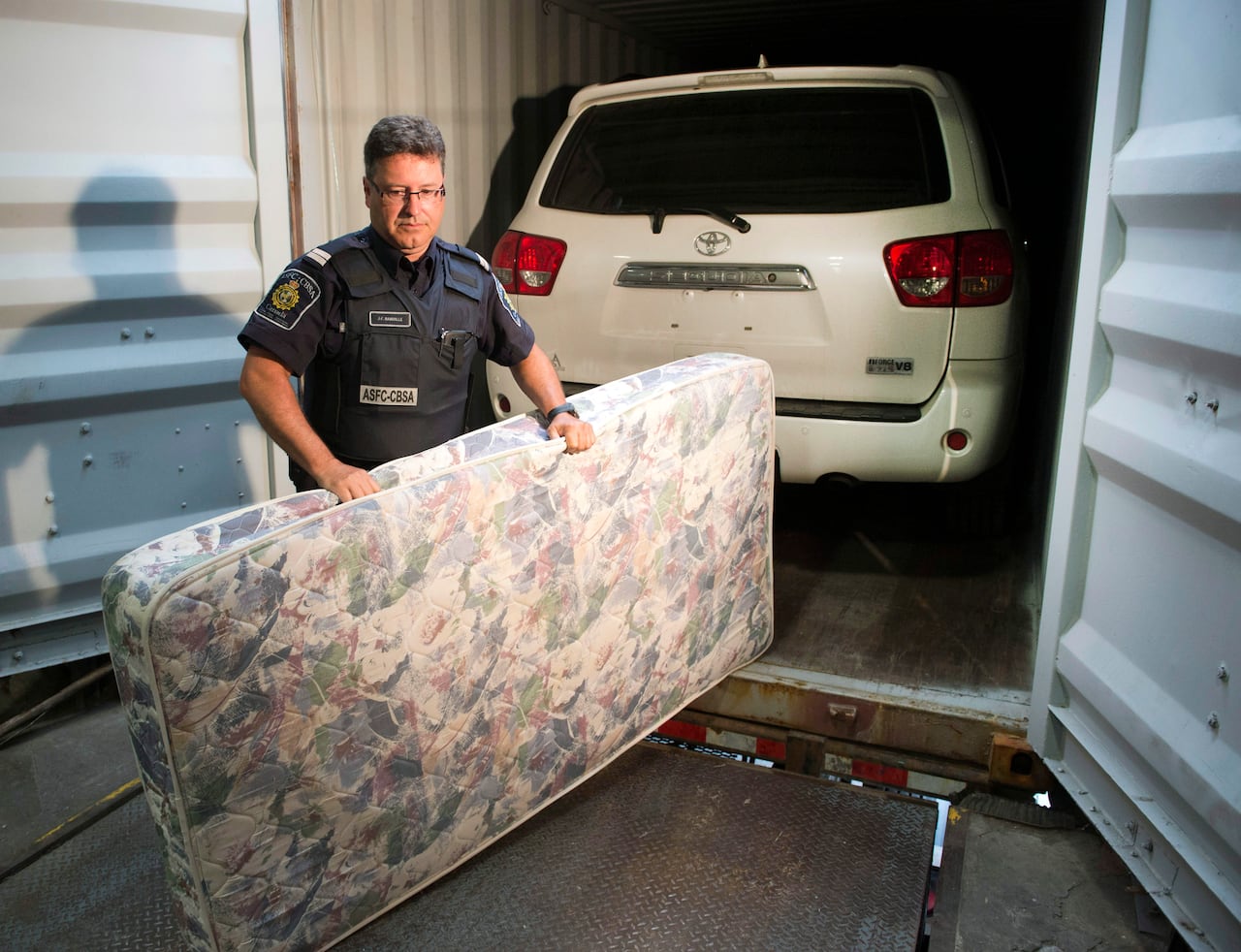 shipping container and police officer