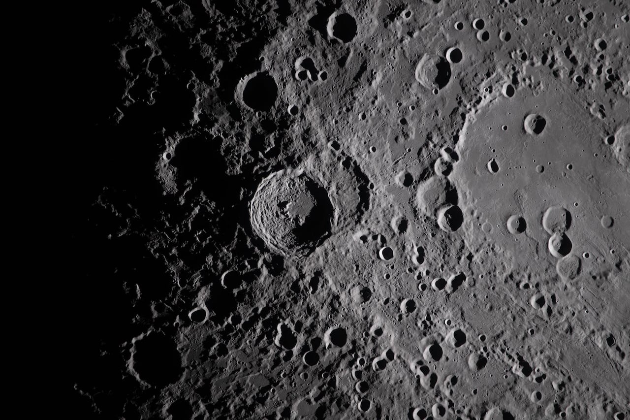 A close up view of a large crater on the moon's surface.
