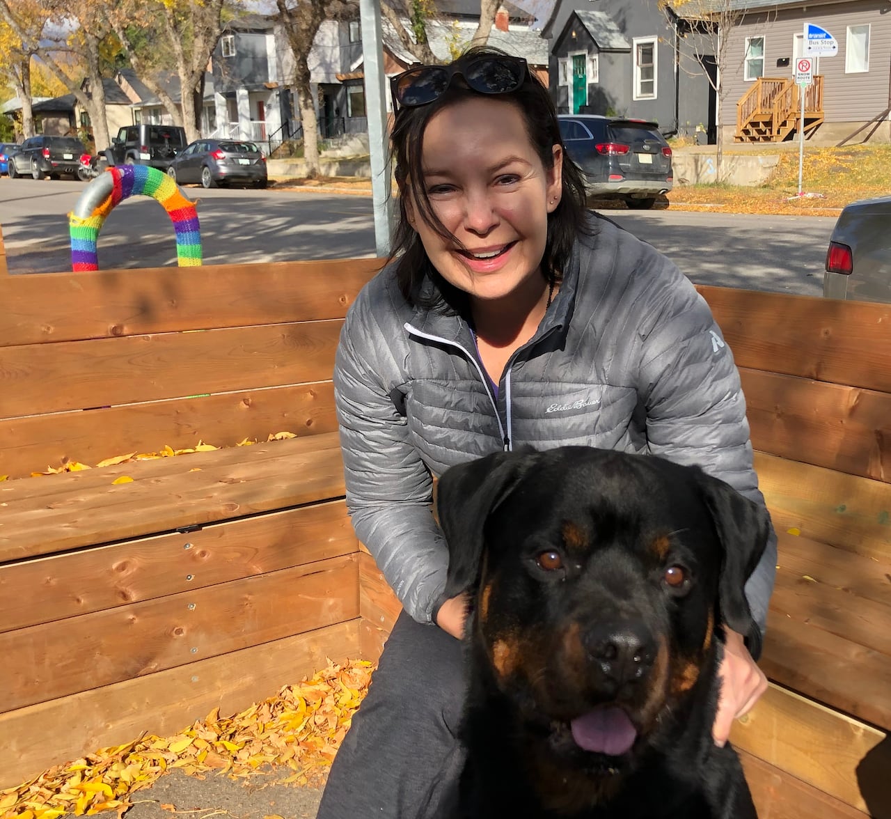 Woman on patio with dog.