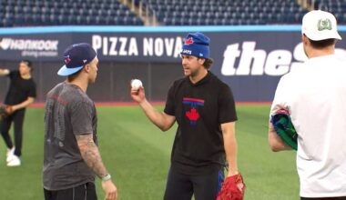 Maple Leafs players play catch with Blue Jays at Rogers Centre