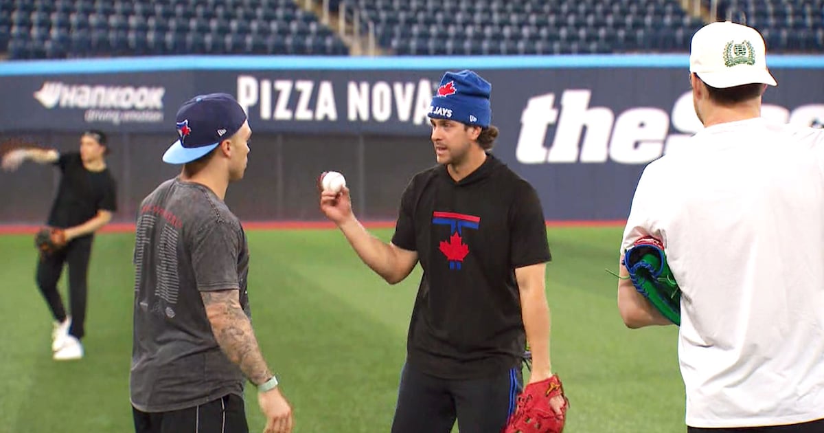 Maple Leafs players play catch with Blue Jays at Rogers Centre
