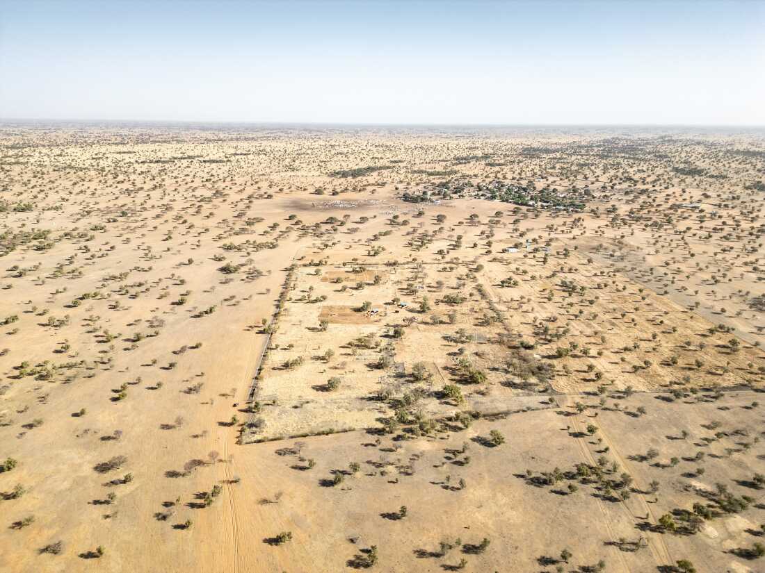 Aerial view of a farm run by Senegal's Great Green Wall agency outside Widou Thiengoly (visible in the background), in the Ferlo Desert. The farm failed once, and has now been resurrected thanks to funding from a Moroccan phosphate mining company.