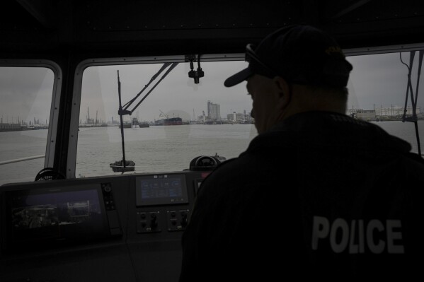 A Port of Corpus Christi police officer guides a boat through the port Thursday, Nov. 16, 2023, in Corpus Christi, Texas. (Jon Shapley/Houston Chronicle via AP)