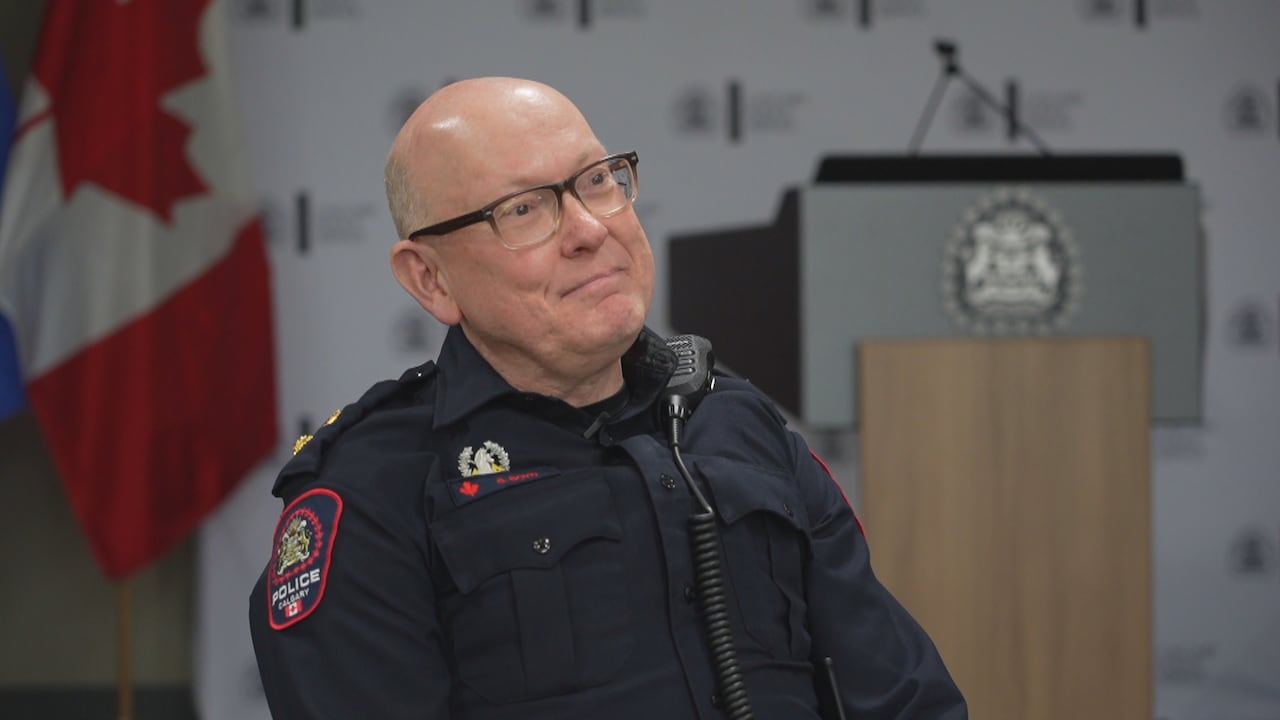 bald police officer smiling
