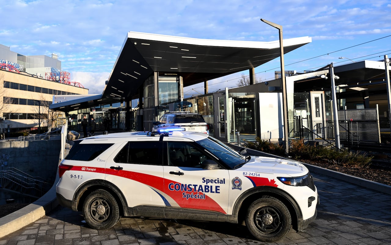A transit security vehicle outside a station on a university campus.