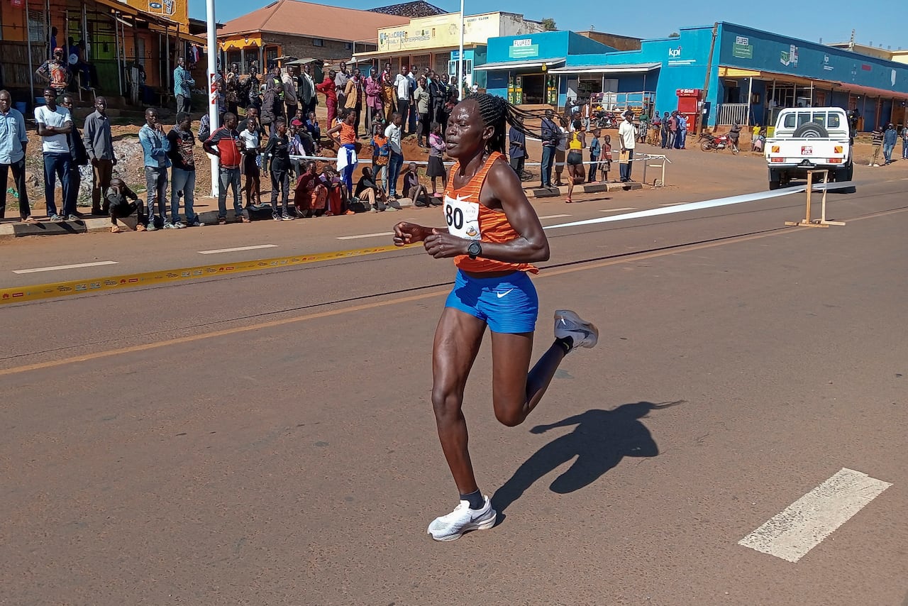 A woman runs in a road race.