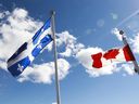 The flags of Quebec and Canada.