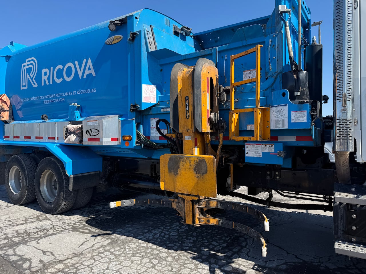 blue garbage truck, with sensors on them